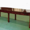 A Biedermeier extendable dining table with diagonally banned legs and cross banded details