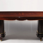 An extendable dining table in the manner of Jules Leleu