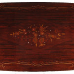 An extendable dining table in the manner of Jules Leleu