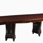An extendable dining table in the manner of Jules Leleu