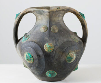 A carved dark grey pottery amphora