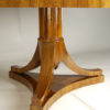 An Austrian Biedermeier inspired double pedestal extendable dining table