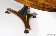 A regency-style extendable single pedestal dining table with drop-down legs 3