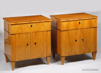 An elegant pair of Biedermeier style two door night stands