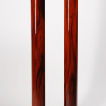 A modernist style display pedestal in rosewood with ebonized detail