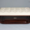 A Modernist style upholstered ottoman