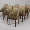 A set of six Captain dining chairs in the style of D.I.M