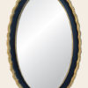 A Clam-shell style oval gallery mirror by ILIAD Design