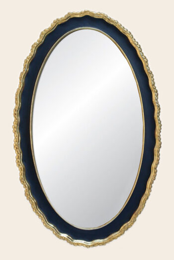 A Clam-shell style oval gallery mirror by ILIAD Design