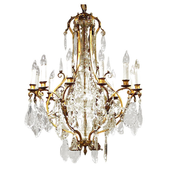 A Bohemian crystal and cutglass bronze twelve light chandelier