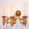 A fine and unusual pair of late Empire three arm wall  sconces