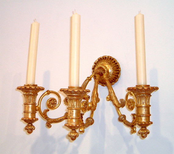 A fine and unusual pair of late Empire three arm wall  sconces