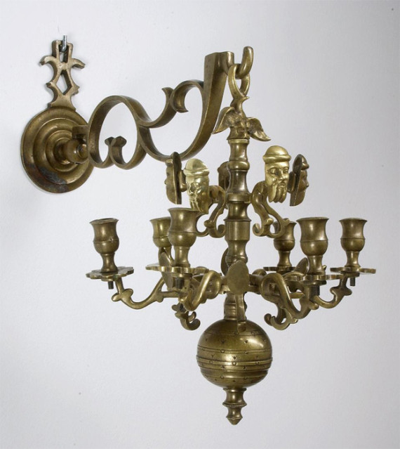 A pair of bronze seven-arm sconces