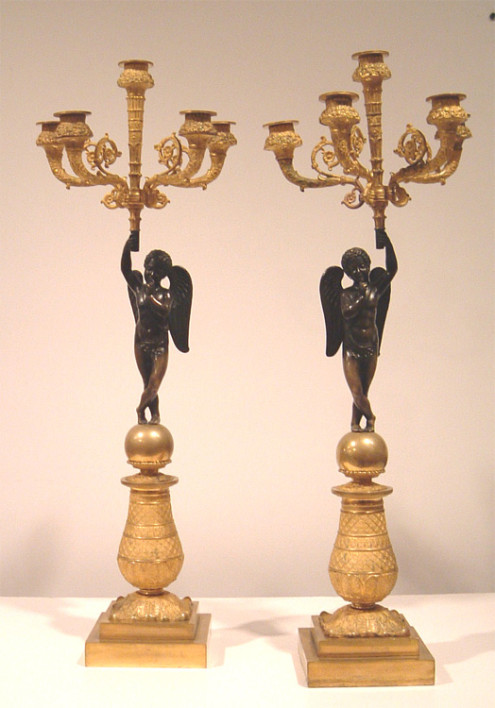 A fine pair of Empire five-arm candlesticks