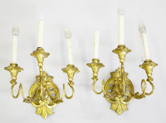 An elegant pair of three arm Neoclassical candle sconces