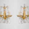 A pair of gold-plated Baccarat sconces