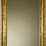 A Biedermeier mirror with egg and dart detail