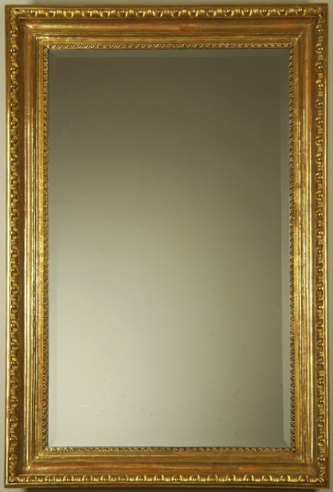 A Biedermeier mirror with egg and dart detail