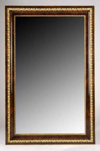 A Biedermeier mirror with egg and dart detail