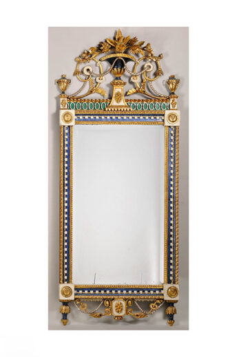 A richly decorated Empire-style mirror