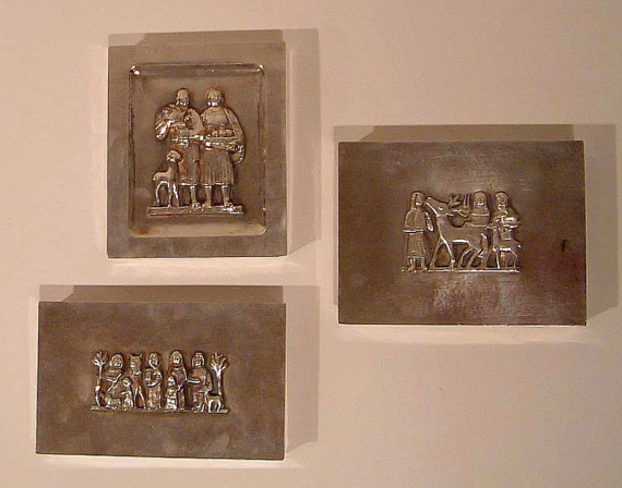 Three small silverplate cigarette boxes with figural reliefs