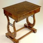 An elegant Biedermeier lyre-shaped occasional table