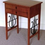 A Biedermeier two drawer sewing table
