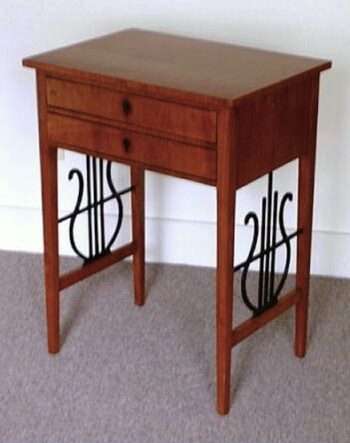 A Biedermeier two drawer sewing table