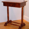 A Biedermeier occasional table with a single drawer