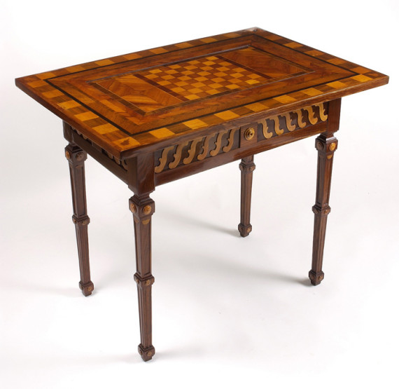 An unusual Neoclassical games table with inlaid chess- and backgammon-boards on a spin-plate