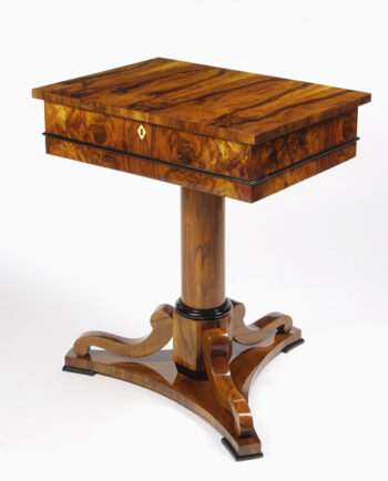 A Biedermeier work table with a lift top