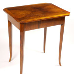 A Biedermeier occasional table with one drawer