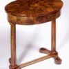 An elegant and moderne Biedermeier single drawer occasional table