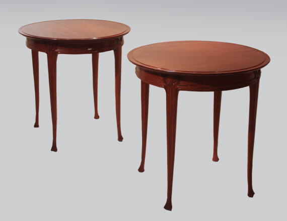 A pair of elegant French Art Nouveau end tables