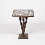 An elegant forged iron and marble side table attributed to Paul Kiss