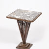 An elegant forged iron and marble side table attributed to Paul Kiss