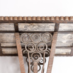 An elegant forged iron and marble side table attributed to Paul Kiss
