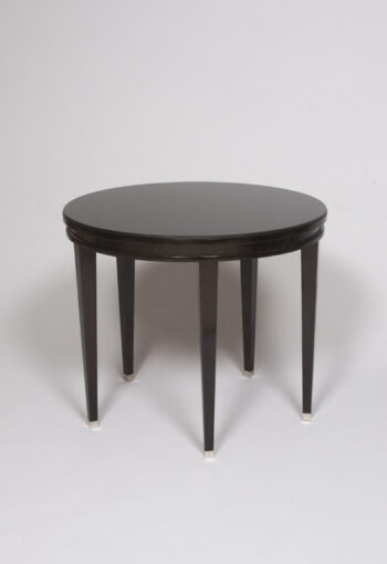 An ebonized occasional table by Jacques Adnet