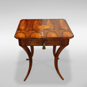 An elegant Biedermeier single drawer sewing table