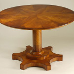 An unusual Biedermeier tilt-top pedestal table