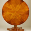 An unusual Biedermeier tilt-top pedestal table