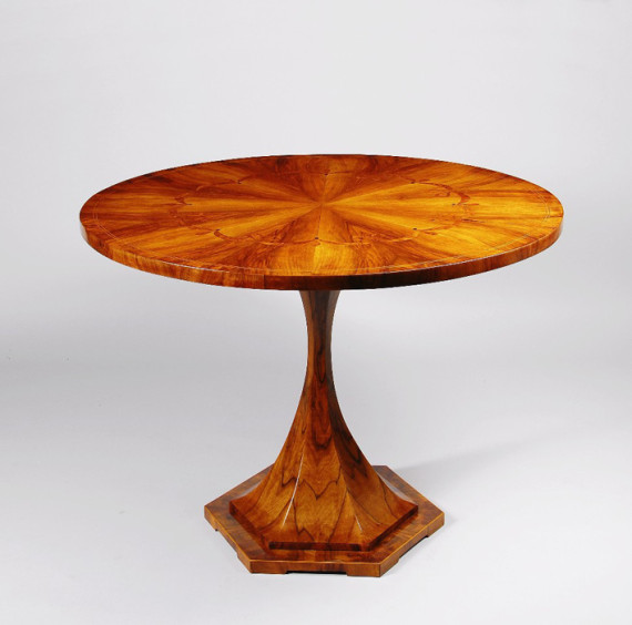 A Biedermeier trumpet style pedestal table