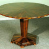 A fine and geometric Biedermeier tilt-top pedestal table