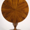 A petite Biedermeier tilt top pedestal table