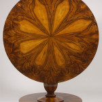 An elegant Biedermeier tilt-top pedestal table