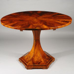 A sleek and moderne trumpet-style Biedermeier pedestal table