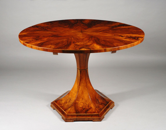 A sleek and moderne trumpet-style Biedermeier pedestal table