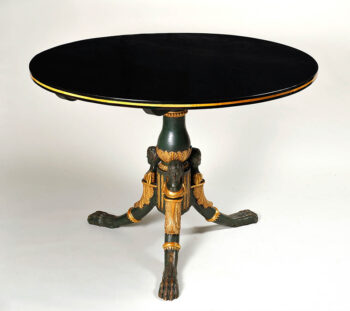 An Empire Style Pedestal Table with Elaborately Carved Details.