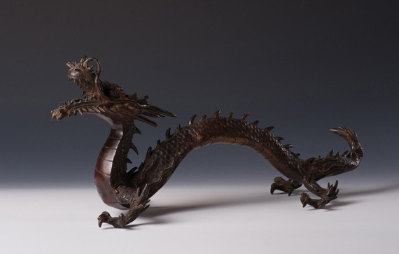 A bronze okimono of a dragon