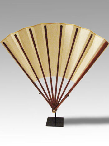 A gold-speckled Fan with bamboo fan guards with circular head and bone domed boss with a metal rivet